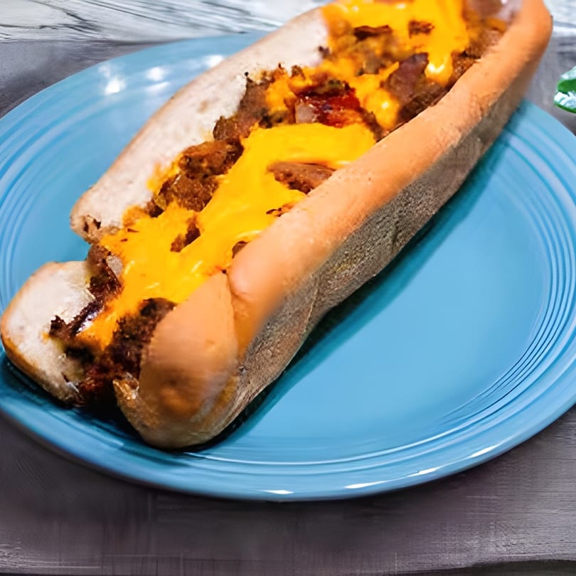 Cheesesteak sandwich with melted cheese and steak on a blue plate at Buffalo Bill's Wings & Things.